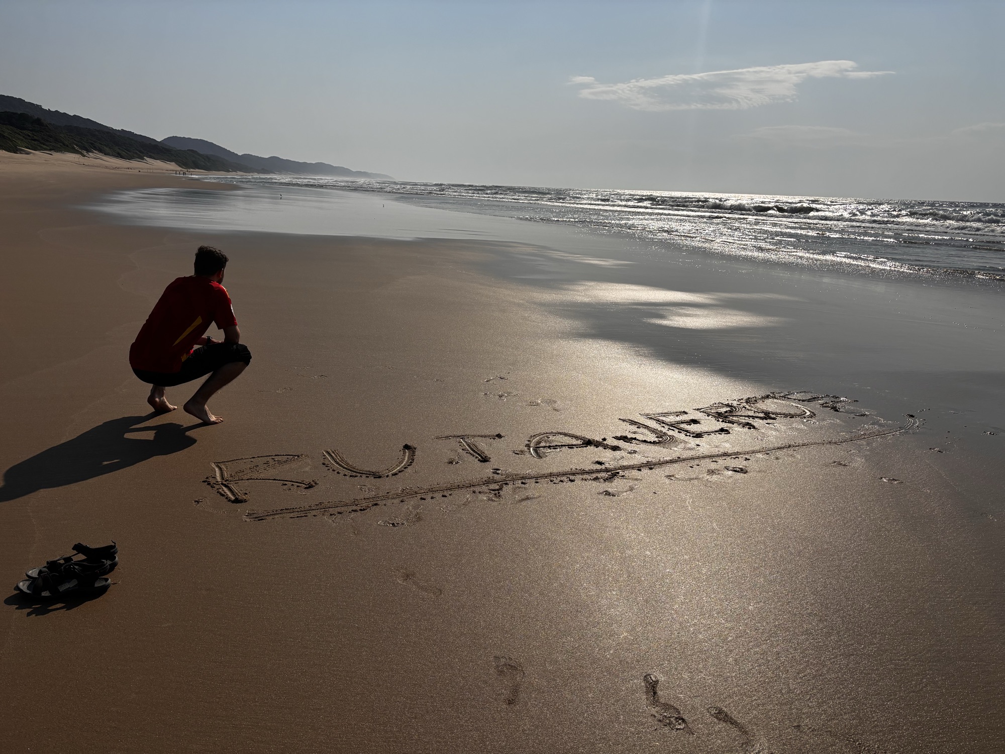 Rutajeros escrito en la arena de la playa de Cape Vidal